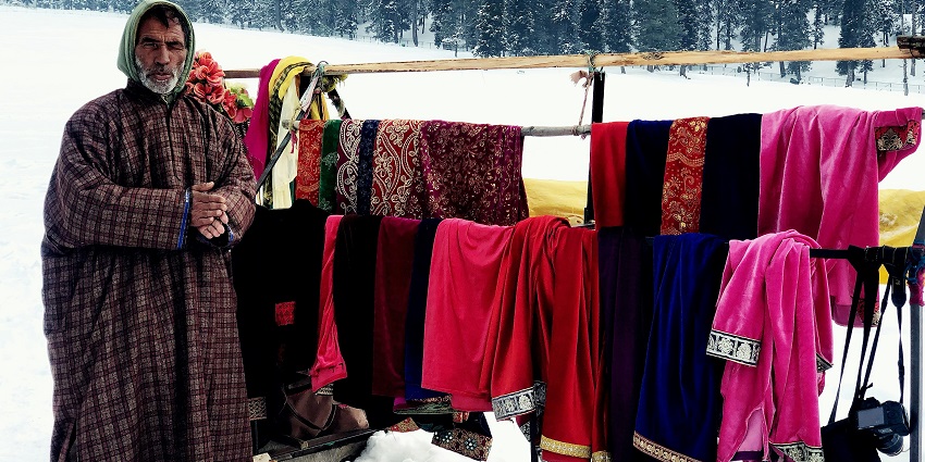A person selling clothes in Anantnag, that can be taken as souvenirs for your loved ones.