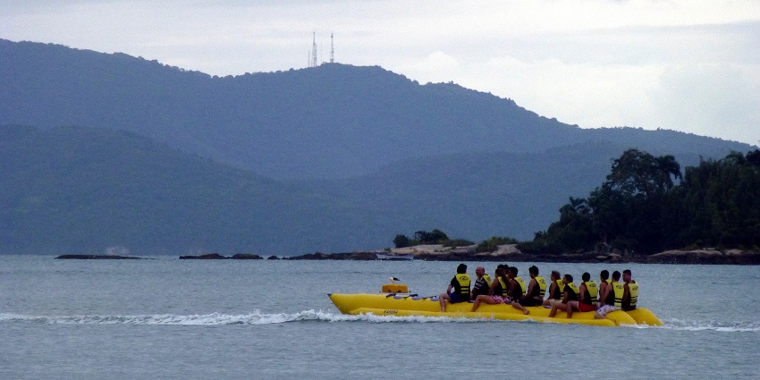 A group of people enjoying a thrilling banana boat ride while viewing the scenery