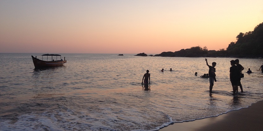 A view of the sunset at the Kudli beach in Gokarana with the mountains in the backdrop