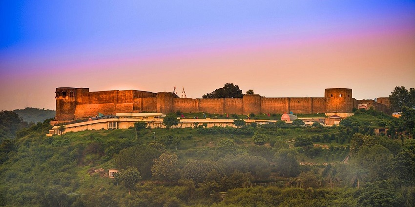 A panoramic view of the colourful landscapes of the Bahu Fort with lush green landscapes