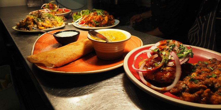Taste vegetarian and non-vegetarian delicacies at the eateries near the Karimutty Waterfall