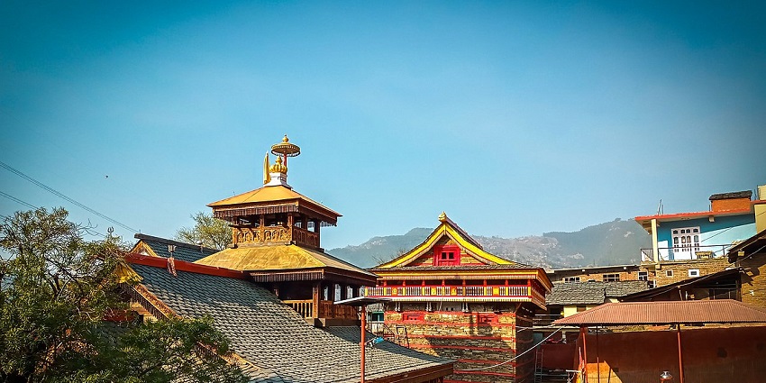 View of a revered temple that is dedicated to Lord Shiva with the backdrop of the mountains