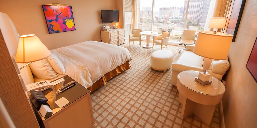 A picturesque view of a hotel room with a single bed that provides a comfortable stay