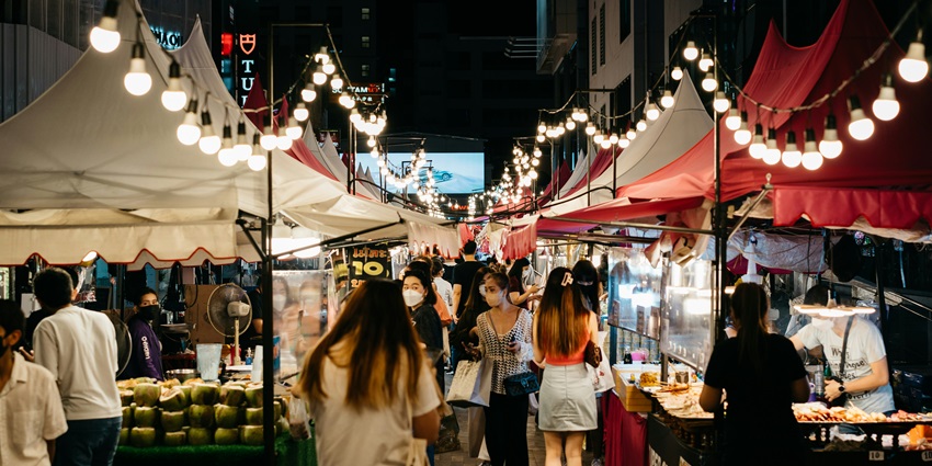 Bustling streets of Aberdeen Bazaar, with shops lining the street and tourists roaming around.