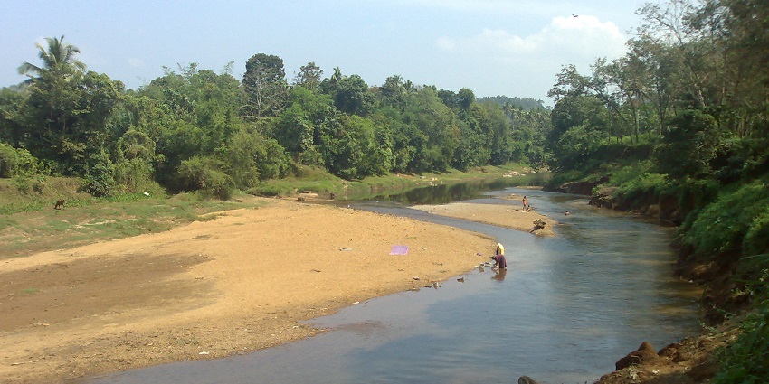 Sit back and relax by the Achankovil River on your trip to the Western Ghats in Kerala.