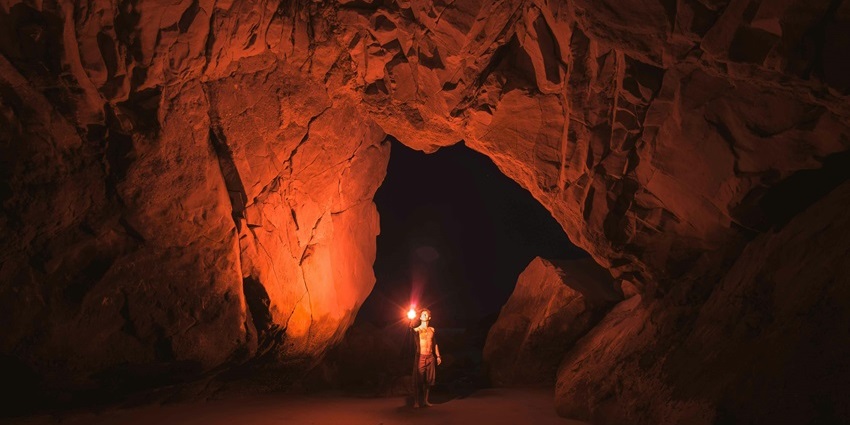 Mysterious limestone formations inside the dark chambers of Alfred Caves.