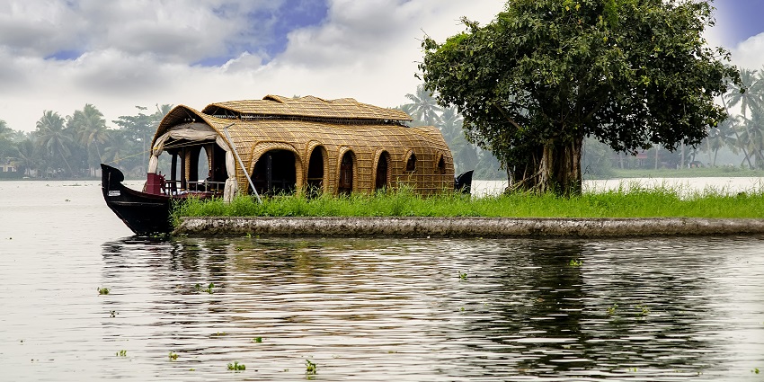 Scenic houseboat in Alleppey is one the interesting places to visit in summer in Kerala