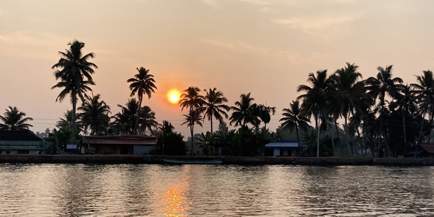 Enjoy the sunrise at the Alleppey backwaters and canals in Kerala on your trip here