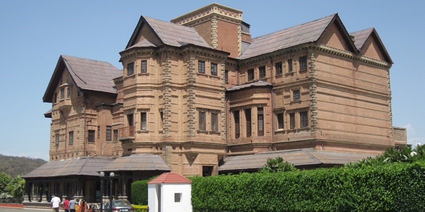 A glimpse of the majestic Amar Mahal Palace Museum adorned with quaint rustic details.