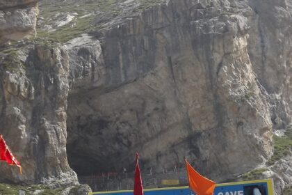 Sacred Amarnath Temple, housing a natural ice Shiva Lingam amidst rugged mountains.