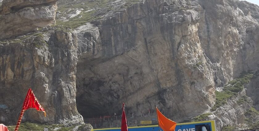 Sacred Amarnath Temple, housing a natural ice Shiva Lingam amidst rugged mountains.