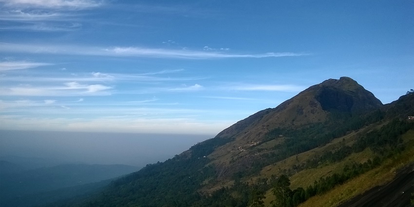 A view of Anamudi Peak in Kerala with the backdrop of the clouds and blue azure skies