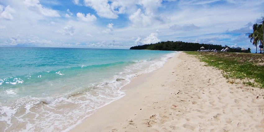 A picture of a beautiful beach in Andaman with golden sand and turquoise waters