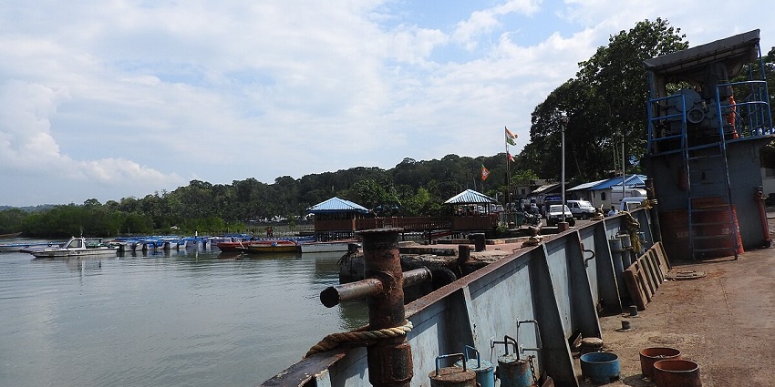 Baratang Island waterways transportation: Boat navigating through lush mangrove forests