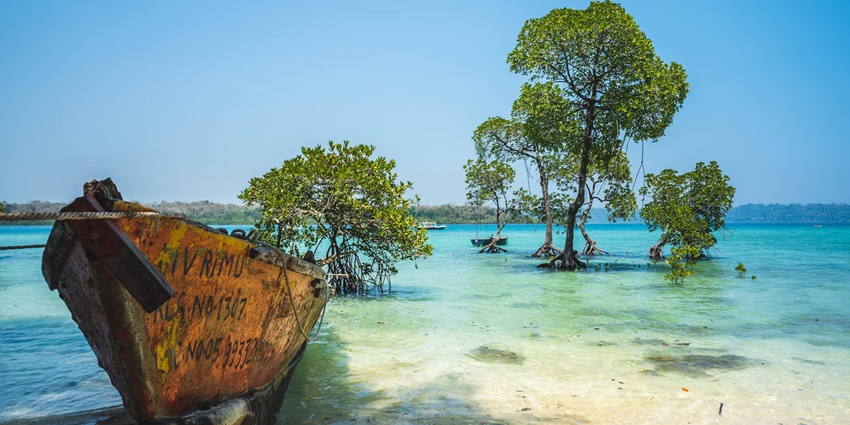A boat on the Andaman beach, which is one of the scenic places to visit in April in India