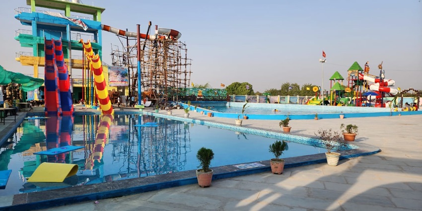 Water Park with colorful slides and pools surrounded by greenery—water parks in trivandrum