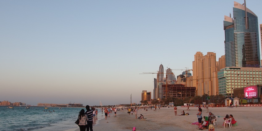Aquaventure Beach in Dubai featuring soft white sand, luxury cabanas, water sports, and stunning views of the city skyline.