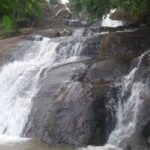 A breathtaking view of a waterfall in Kerala, a must-visit attraction for travellers.