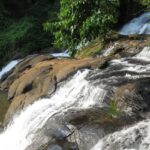 Enjoy a refreshing escape to Aruvikuzhy Waterfalls in Idukki amidst the lush landscapes.