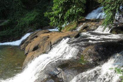 Enjoy a refreshing escape to Aruvikuzhy Waterfalls in Idukki amidst the lush landscapes.