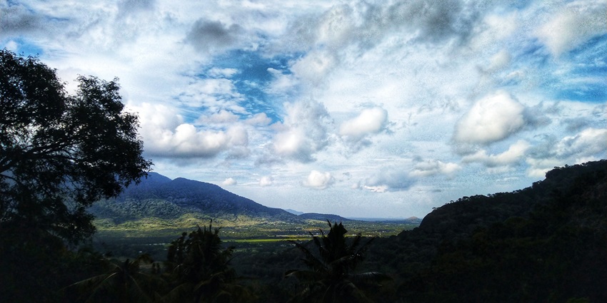 Picturesque view of the Aryankavu hills looking over the verdant meadows and hills beyond