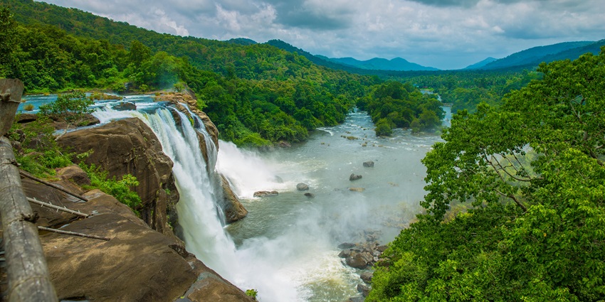 Athirapally Falls in Kerala cascading with full force amid misty–places to visit in kerala in november