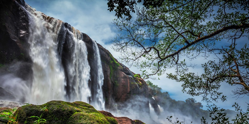 Witness the majestic Athirapally Waterfalls, near Thrissur Zoo & Museum in Kerala, India.