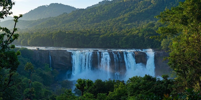 The lushy green forests surrounding the Athirapally Waterfalls after the monsoon rains.