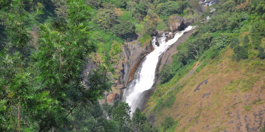 Mesmerising view of sparkling water cascading down the rocks of attukal waterfalls