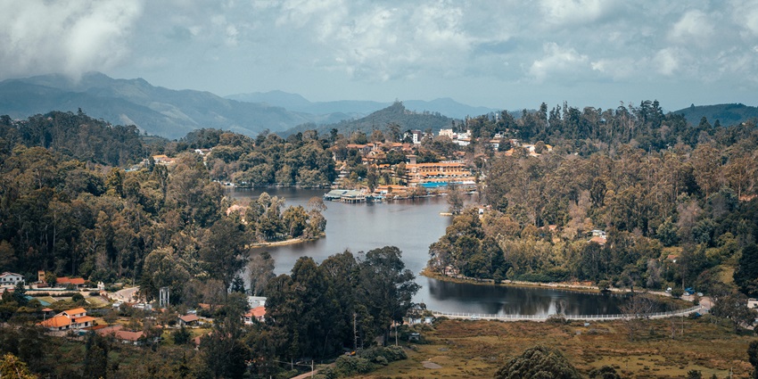 An aerial picture of a majestic lake near Attapadi, surrounded by lush green forests
