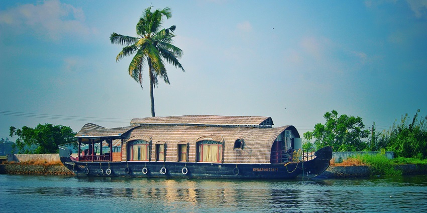 The view of Houseboat on river among exotic nature - best places to visit in Bekal