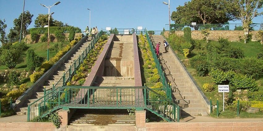 Tourists flock the lush Bagh-e-Bahu gardens that surround the scenic Bahu Fort Jammu