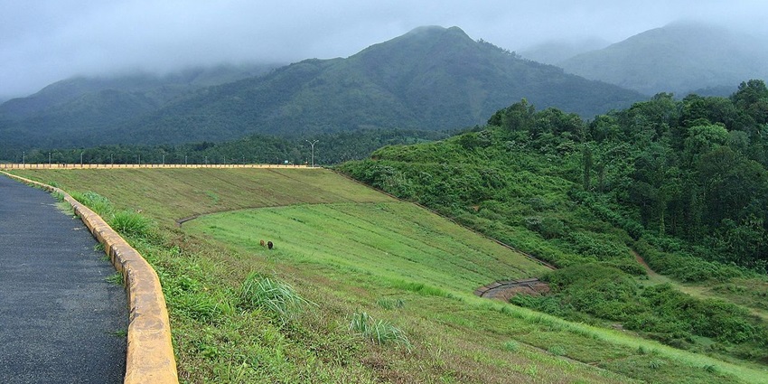 Scenic view from the Banasura Sagar dam looking over the fog covered mountain beyond
