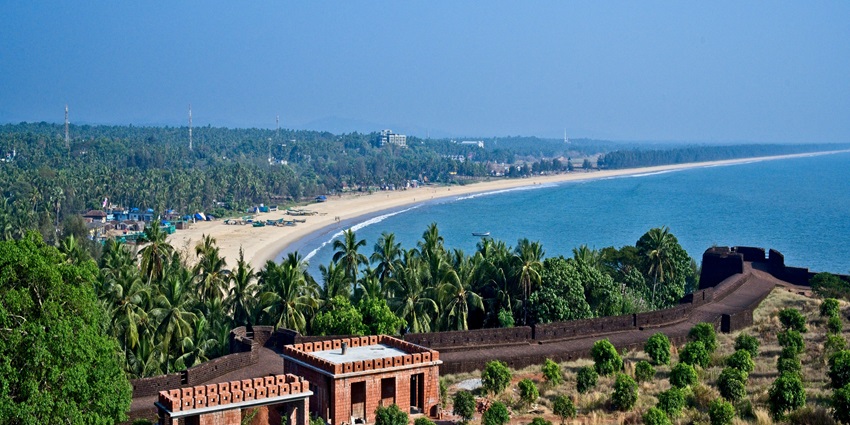 An aerial view of Bekal decked with azure waters, palm trees, and the famous Bekal Fort.