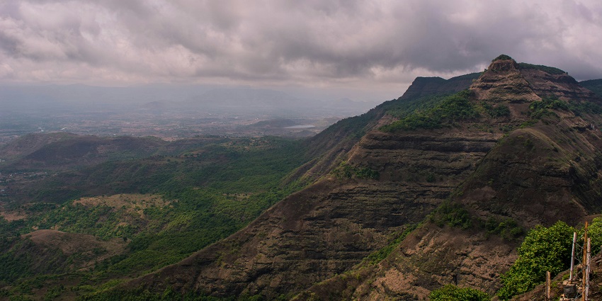 A valley with hills and clouds