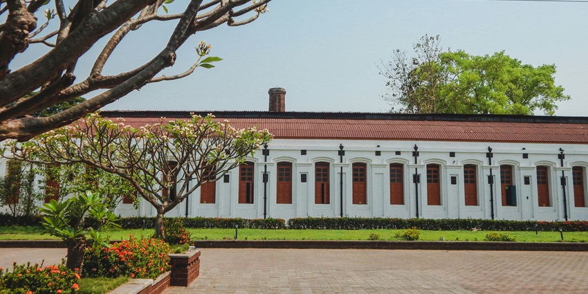 Bharath Bhavan exteriors showing the intricate details, also surrounded by lush greenery.