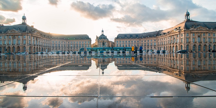 A landscape view of a green and brown palace in Bordeaux, Nouvelle-Aquitaine, France
