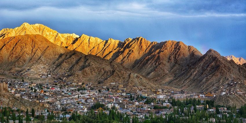 Get lost in the awe-inspiring beauty of Leh among the brown mountains and lush greenery.