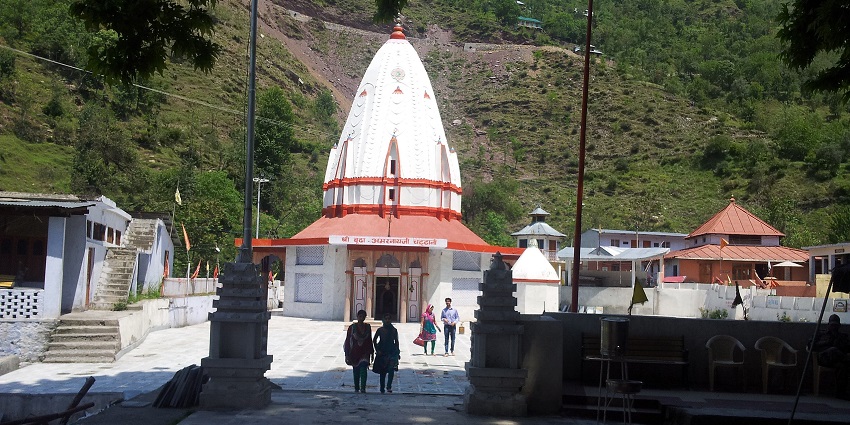 An image of Buddha Amarnath Temple, surrounded by scenic mountains and nature.