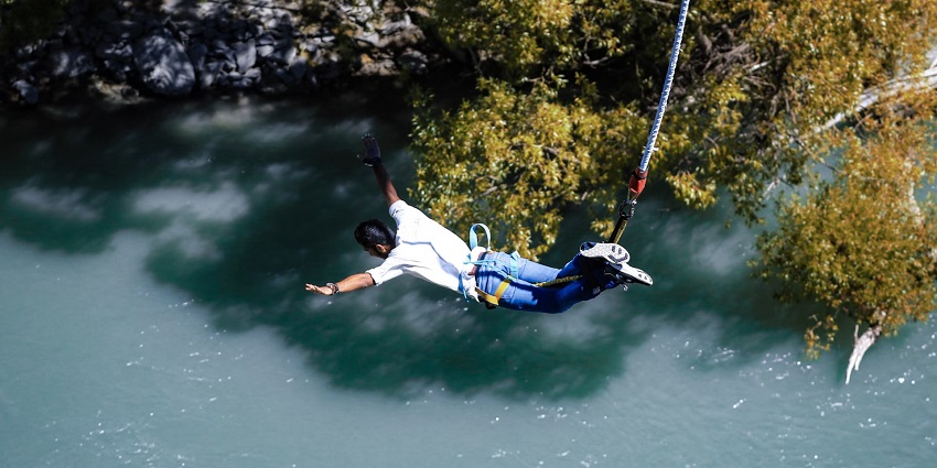 Try out bungee jumping on your next vacation to add a different experience to your life.