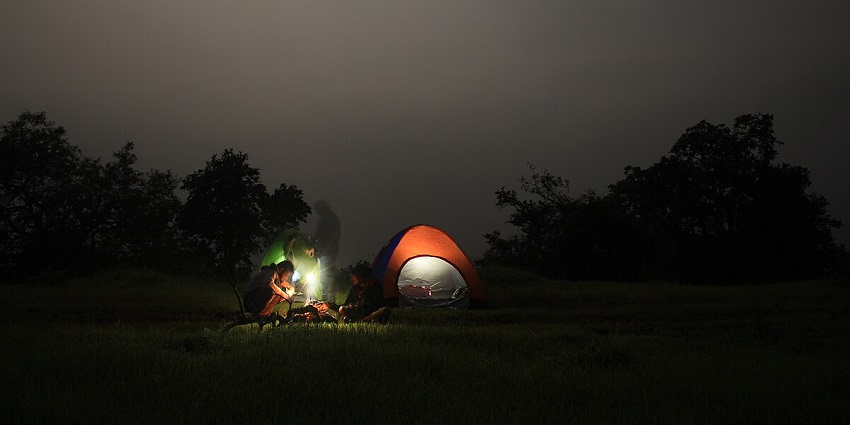 Camping in the wild with friends under the sky