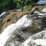 Kottayam waterfalls in Kerala is a captivating sight with the backdrop of forests