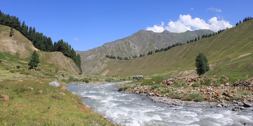 A breathtaking landscape of Gurez Valley with majestic mountains in the backdrop.
