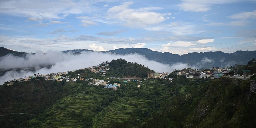 View of the town of Chamba with the misty mountains far beyond offering a picturesque sight