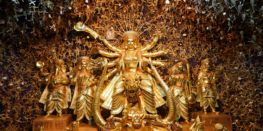 Hindu goddess Durga shining in golden colour, reflecting both femininity and power.