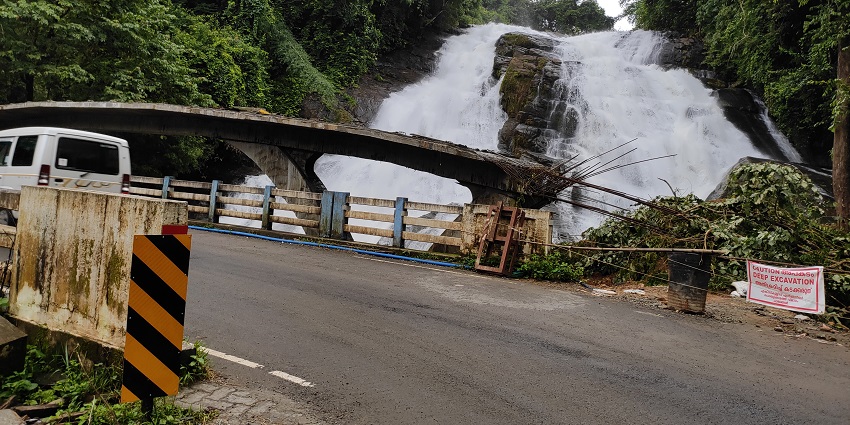 A picturesque sight of the Chapra waterfalls encircled amidst dense green blankets