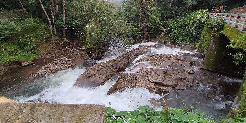 Witness the scenic views of Chara Waterfalls, near Athirapally Waterfalls, Kerala.