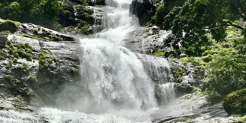 The scenic view of cascading waterfalls is one of the best places to visit in Munnar