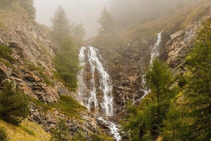 Sceic picture of a waterfall taken from a distance - Chellarkovil Waterfalls in Kerala