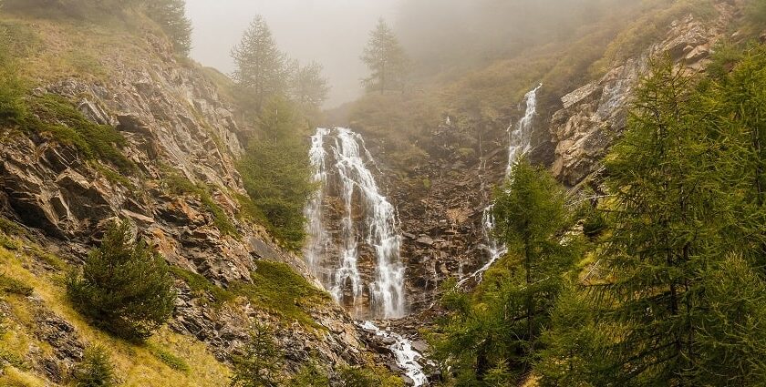 Sceic picture of a waterfall taken from a distance - Chellarkovil Waterfalls in Kerala